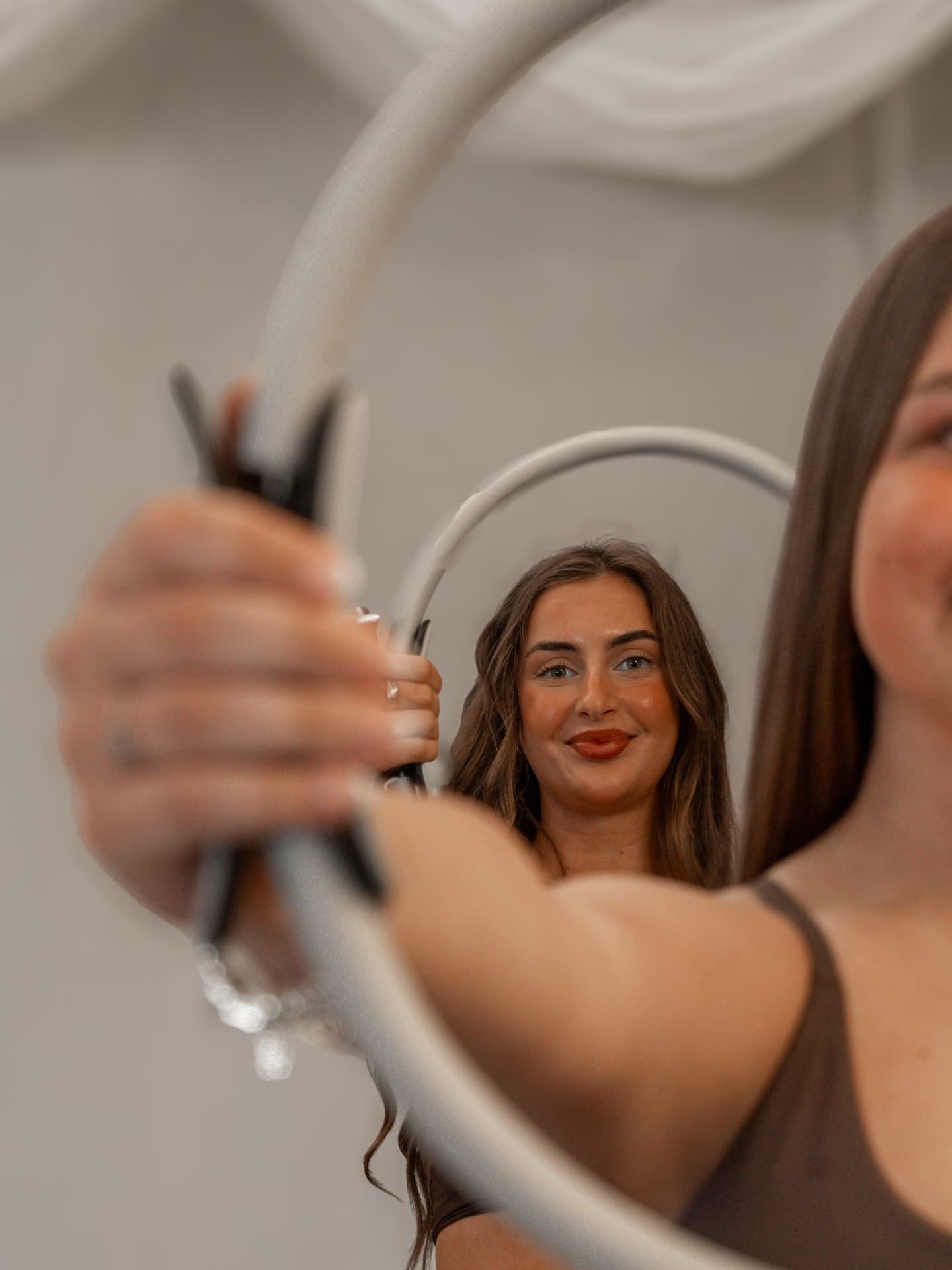 A member smiling on the reformer